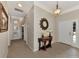 Elegant entryway with tile flooring, a decorative mirror, and access to other rooms at 2619 Wax Myrtle Ct, Port Charlotte, FL 33953