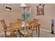 Charming dining area with wood table and chairs near kitchen at 2685 Wax Myrtle Ct, Port Charlotte, FL 33953