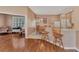 Kitchen with light wood cabinets, a breakfast bar, and a view into the office at 2685 Wax Myrtle Ct, Port Charlotte, FL 33953