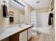 Bathroom with a shower-tub combination with a shower curtain and tile floors at 514 Pine Hollow Cir # 514, Englewood, FL 34223