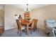 Cozy dining room with table and chairs for six at 514 Pine Hollow Cir # 514, Englewood, FL 34223