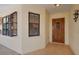 Exterior view of condo with wood door and window at 514 Pine Hollow Cir # 514, Englewood, FL 34223