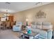 Open-concept living area that transitions into the dining area, providing a perfect space to entertain guests at 514 Pine Hollow Cir # 514, Englewood, FL 34223