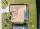 A stunning aerial view showcasing a pool, well manicured backyard, and picturesque waterfront location at 849 Rotonda Cir, Rotonda West, FL 33947