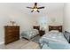 Comfortable bedroom with wood-look floors, two twin beds, and neutral paint at 849 Rotonda Cir, Rotonda West, FL 33947