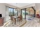 Well-lit dining area boasts sliding glass doors that lead to an outdoor patio and pool area, perfect for entertaining at 849 Rotonda Cir, Rotonda West, FL 33947