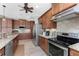 Gourmet kitchen featuring granite countertops, custom cabinets, stainless steel appliances, and tile flooring at 849 Rotonda Cir, Rotonda West, FL 33947