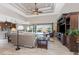 Spacious living room features vaulted ceilings, recessed lighting, and sliding glass doors to the screened lanai and pool area at 849 Rotonda Cir, Rotonda West, FL 33947