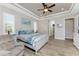 Comfortable main bedroom featuring wood-look floors, stylish decor, and a sitting area at 849 Rotonda Cir, Rotonda West, FL 33947