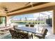 Relaxing patio with a clear view of the pool and lake, perfect for entertaining guests outdoors at 849 Rotonda Cir, Rotonda West, FL 33947