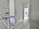 Bright hallway with tile flooring and access to other rooms at 19060 Moscato Ct, Venice, FL 34293