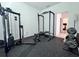 Home gym with weight rack, bench, and free weights at 19060 Moscato Ct, Venice, FL 34293