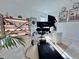 Home office with standing desk, shelving and gym equipment at 19060 Moscato Ct, Venice, FL 34293