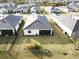 Aerial view of a house showcasing a backyard with lawn at 19060 Moscato Ct, Venice, FL 34293