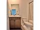 Clean bathroom with a single sink vanity and shower/tub combo at 19060 Moscato Ct, Venice, FL 34293