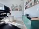 Home office with a standing desk, records, and city prints at 19060 Moscato Ct, Venice, FL 34293