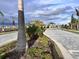 Landscaped entrance to a community with palm trees at 19060 Moscato Ct, Venice, FL 34293