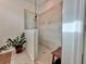Modern shower with glass enclosure and neutral tile at 19060 Moscato Ct, Venice, FL 34293