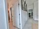 Bright hallway with tile flooring and access to bathroom and living room at 19060 Moscato Ct, Venice, FL 34293