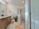 Spa-like bathroom with double vanity, large shower, and tile flooring at 19060 Moscato Ct, Venice, FL 34293