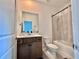 Bathroom features a vanity with single sink and bathtub at 19060 Moscato Ct, Venice, FL 34293
