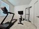 Home gym with Peloton bike and NordicTrack treadmill at 19060 Moscato Ct, Venice, FL 34293