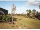 Backyard view with a pond and lush greenery at 19060 Moscato Ct, Venice, FL 34293
