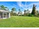 Large backyard with lush green lawn at 2775 Wyola Ave, North Port, FL 34286