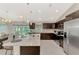 Open kitchen boasts granite counters and stainless steel appliances at 2775 Wyola Ave, North Port, FL 34286