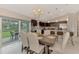 Spacious dining area with table and chairs, and access to the backyard patio at 2775 Wyola Ave, North Port, FL 34286