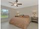 Large main bedroom with ceiling fan, large window and neutral decor at 2775 Wyola Ave, North Port, FL 34286