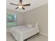 Cozy bedroom with a queen-size bed and a large window at 2775 Wyola Ave, North Port, FL 34286