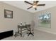 Bright home office features built-in desk and large window at 2775 Wyola Ave, North Port, FL 34286