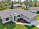 Single-Gathering home with gray exterior and nicely landscaped lawn at 2775 Wyola Ave, North Port, FL 34286