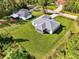 Aerial view of a house, showing a large backyard and neighboring properties at 2775 Wyola Ave, North Port, FL 34286