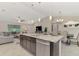 Open concept kitchen features granite countertops, stainless steel appliances, and an island at 2775 Wyola Ave, North Port, FL 34286