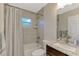 Updated bathroom with a tub, shower, and granite vanity at 2775 Wyola Ave, North Port, FL 34286