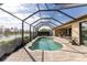 Enjoy this relaxing screened pool and patio area with canal views at 849 Rotonda Cir, Rotonda West, FL 33947