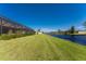 Spacious backyard with canal view and screened enclosure at 849 Rotonda Cir, Rotonda West, FL 33947