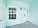 Condo entryway with white door and window, light fixture at 5760 Sabal Trace Dr # 202, North Port, FL 34287