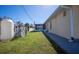 Large backyard with grassy area and screened enclosure at 976 Euclid Rd, Venice, FL 34293