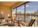 Private patio with lake view and seating area at 514 Pine Hollow Cir # 514, Englewood, FL 34223