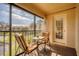 Private patio with lake view and seating area at 514 Pine Hollow Cir # 514, Englewood, FL 34223