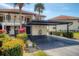 Condo building with carport and landscaped grounds at 514 Pine Hollow Cir # 514, Englewood, FL 34223