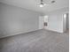 Spacious bedroom with carpeted floor and ceiling fan at 19196 Raymond Ave, Port Charlotte, FL 33954
