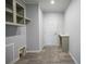 Laundry room with built-in shelving and a small counter at 19196 Raymond Ave, Port Charlotte, FL 33954