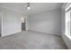 Primary bedroom with carpeted floor and ceiling fan at 19196 Raymond Ave, Port Charlotte, FL 33954