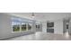 Bright living room with large windows and sliding glass doors at 19196 Raymond Ave, Port Charlotte, FL 33954