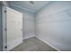 Walk-in closet with wire shelving and gray carpeting at 19196 Raymond Ave, Port Charlotte, FL 33954