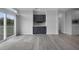 Living room with sliding doors to patio and built-in bar at 19196 Raymond Ave, Port Charlotte, FL 33954
